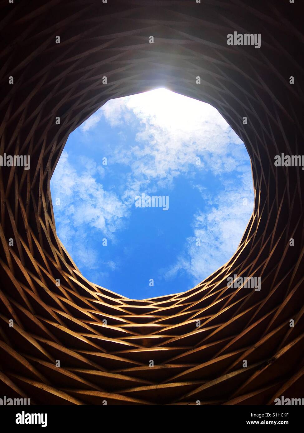 The sky through a hole in the top of a sculpture. Stock Photo