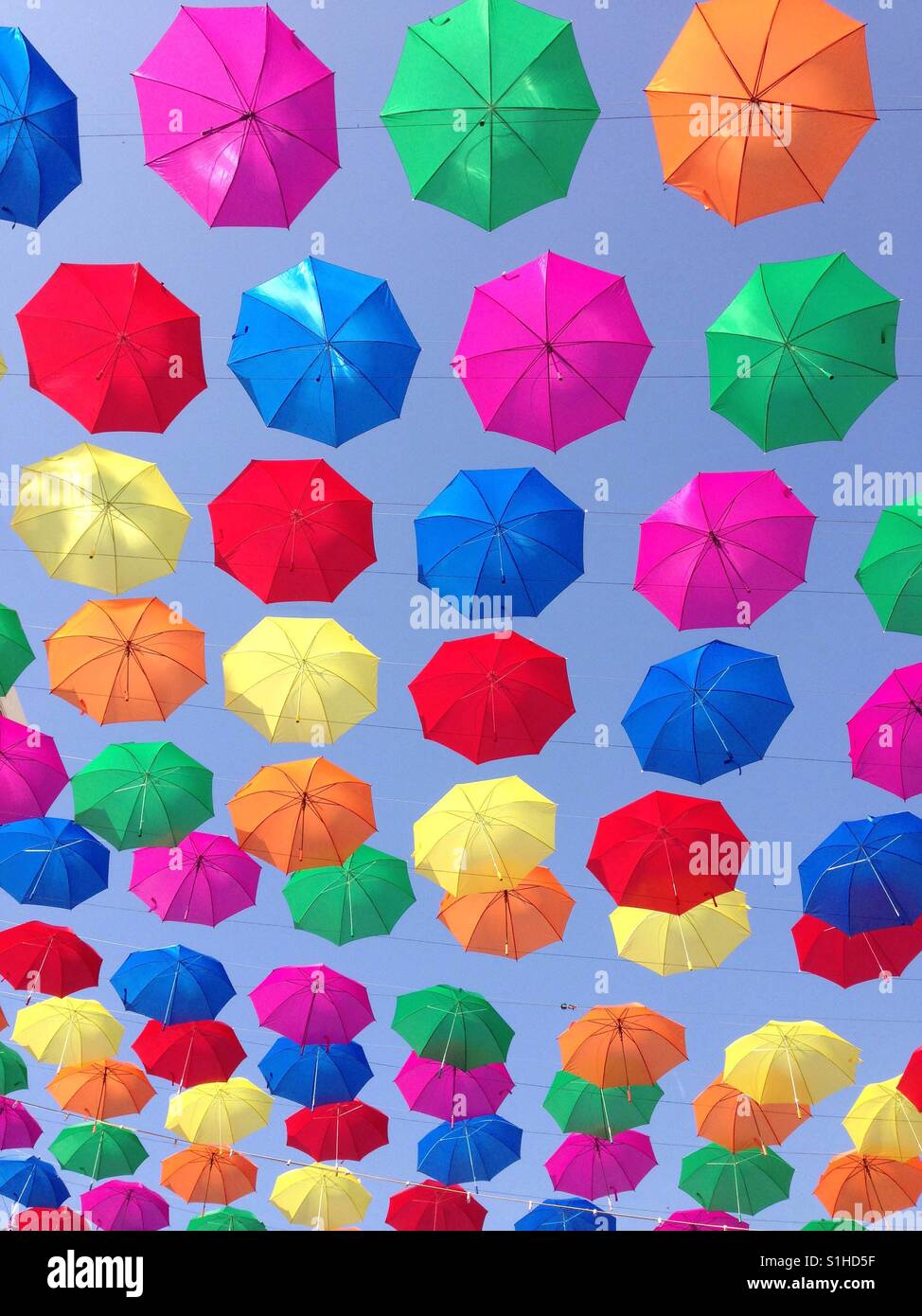 Torremolinos, Spain. Coloured umbrellas hanging above main square to provide shade against high temperatures - Smartphone Captured Stock Image