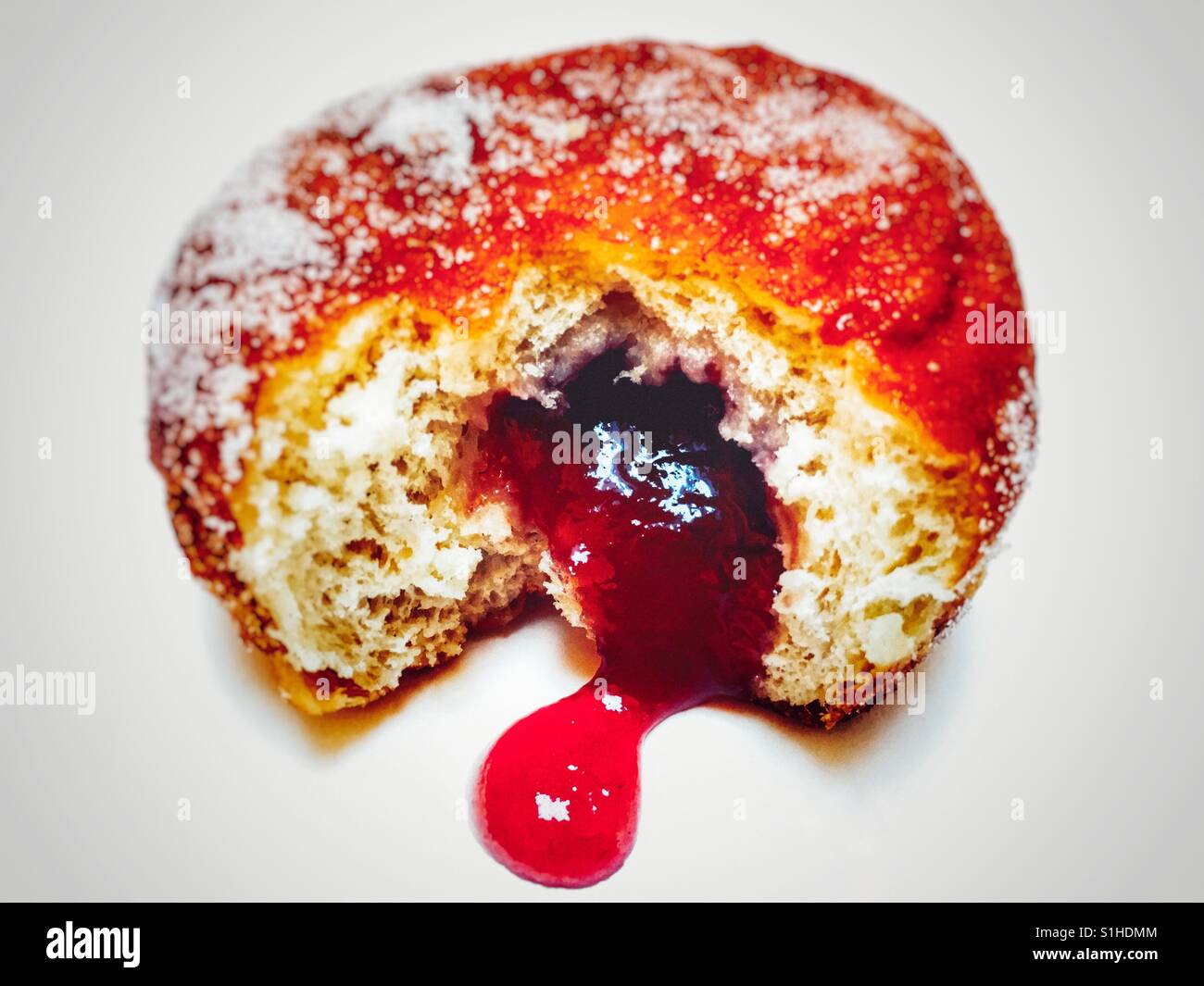 Strawberry jam doughnut Stock Photo Alamy