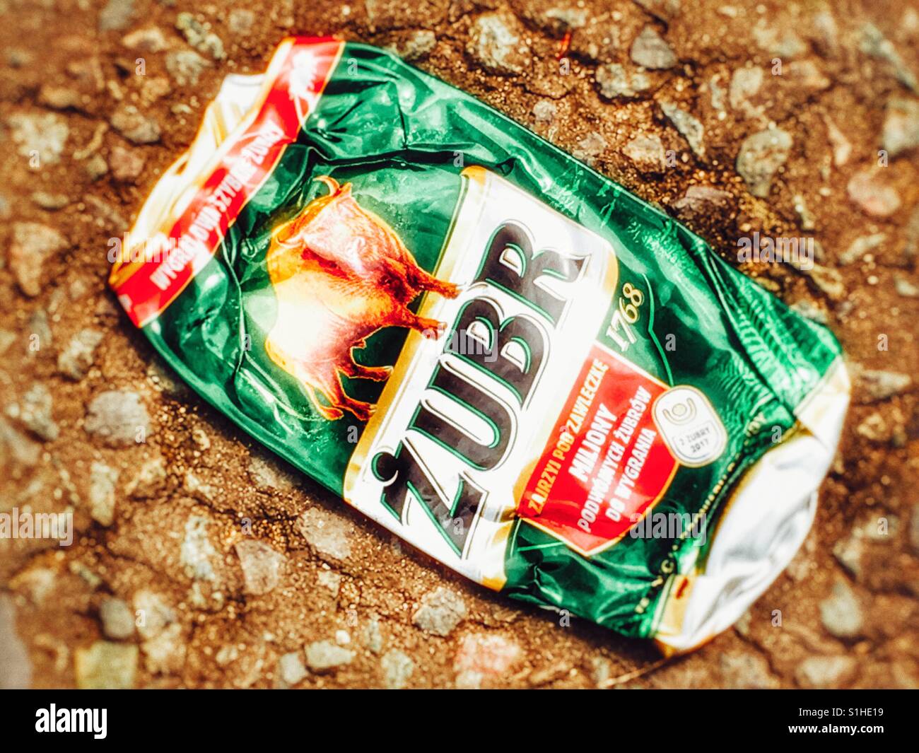 Zubr lager can flattened in road Stock Photo
