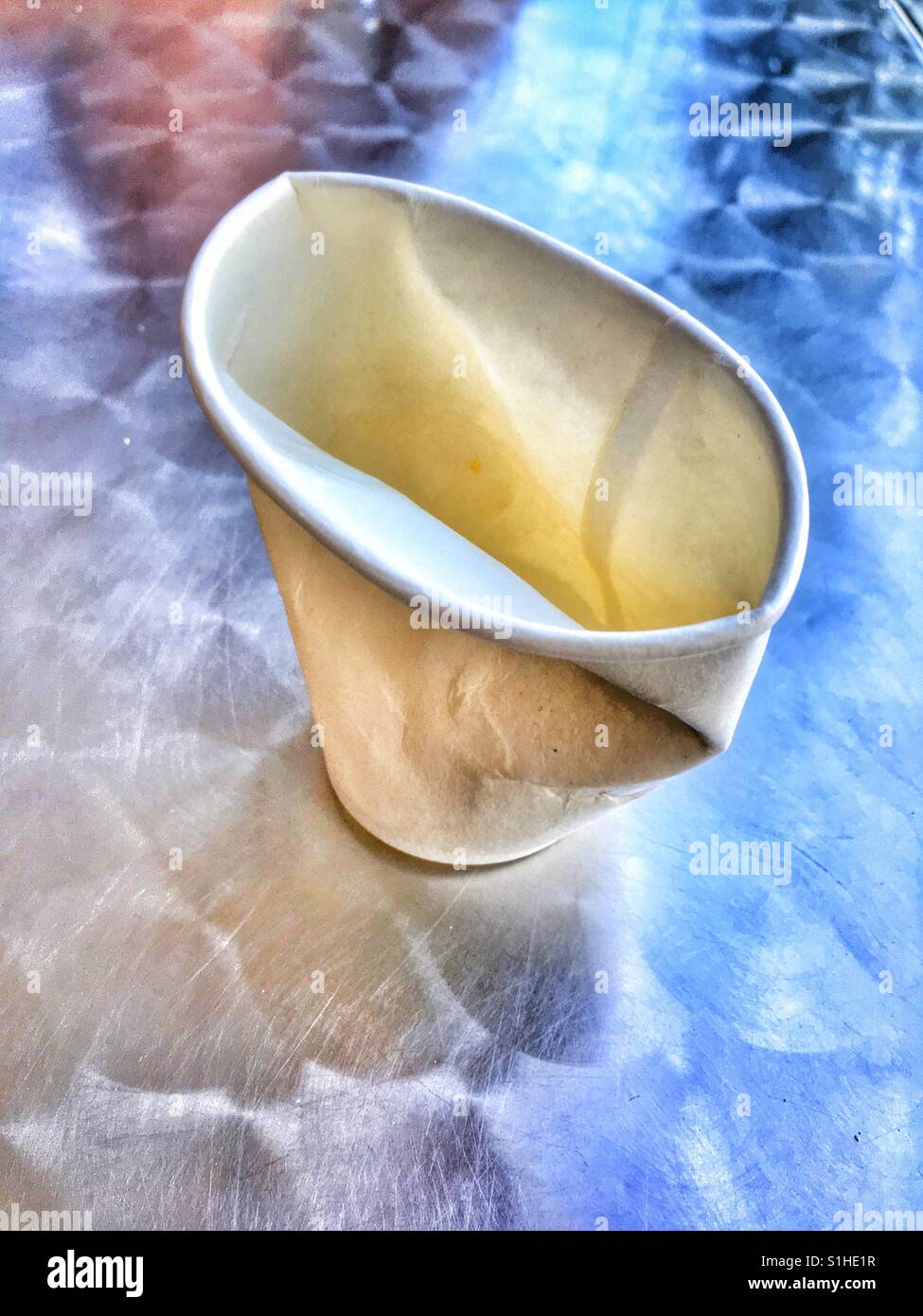 Discarded disposable paper cup. - Smartphone Captured Stock Image