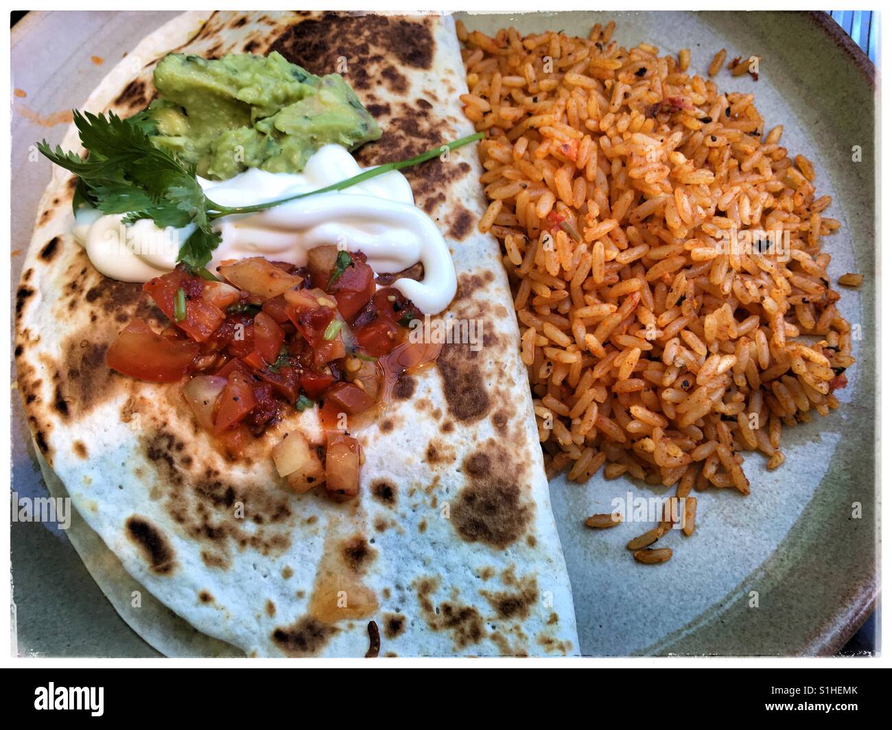 Mexican tortilla wrap with spiced rice Stock Photo Alamy