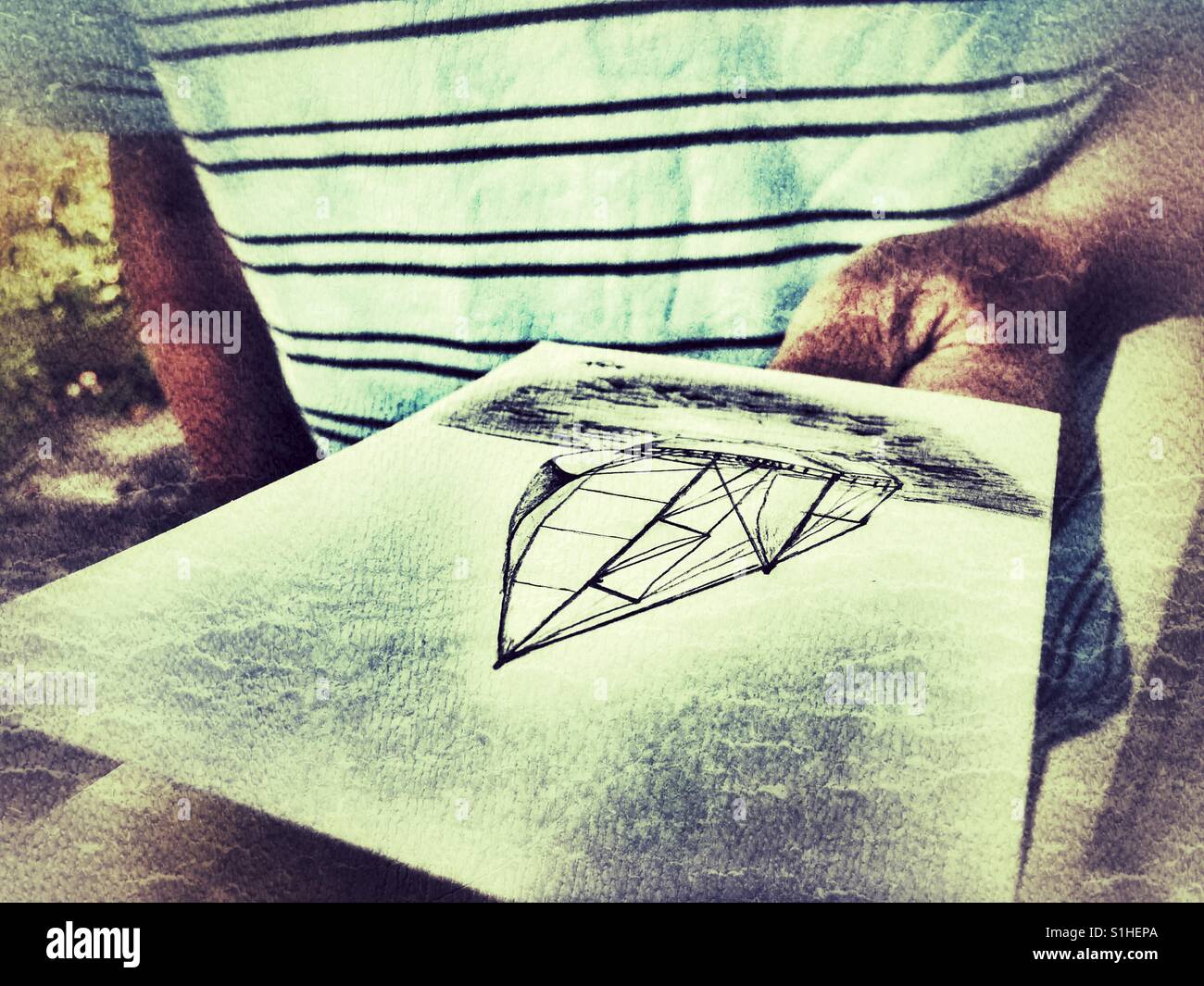 Father's Day, Dad looking at his handmade homemade card. - Smartphone Captured Stock Image