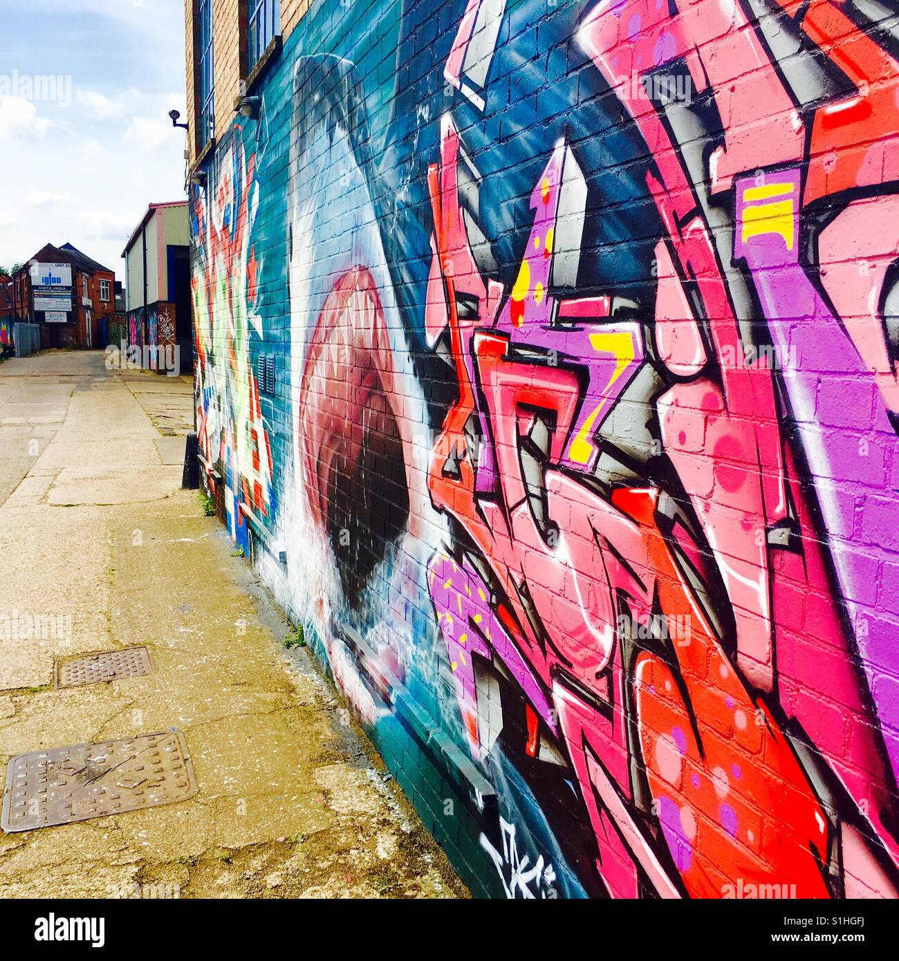 A wall covered in colourful graffiti in Frog Island, Leicester, UK. Stock Photo