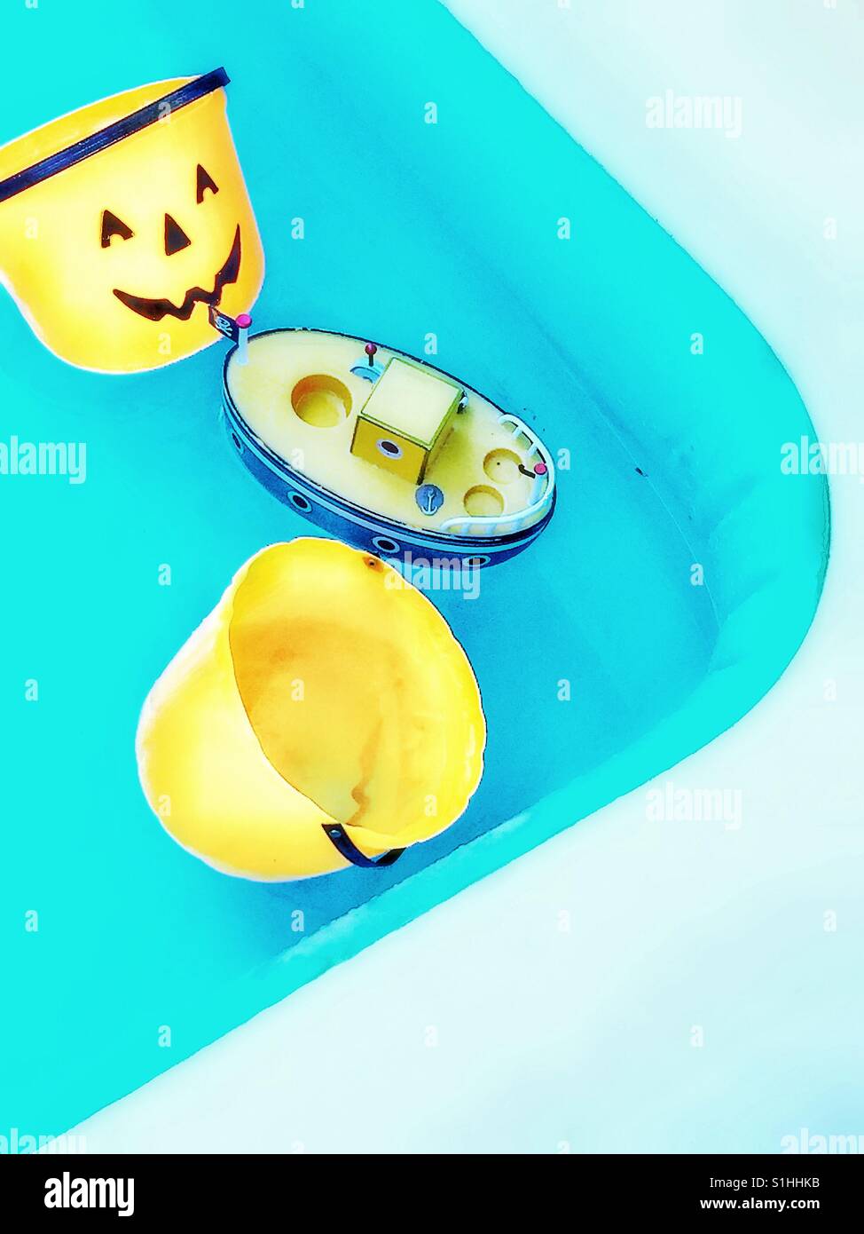 Kids toys floating in a paddling pool. - Smartphone Captured Stock Image