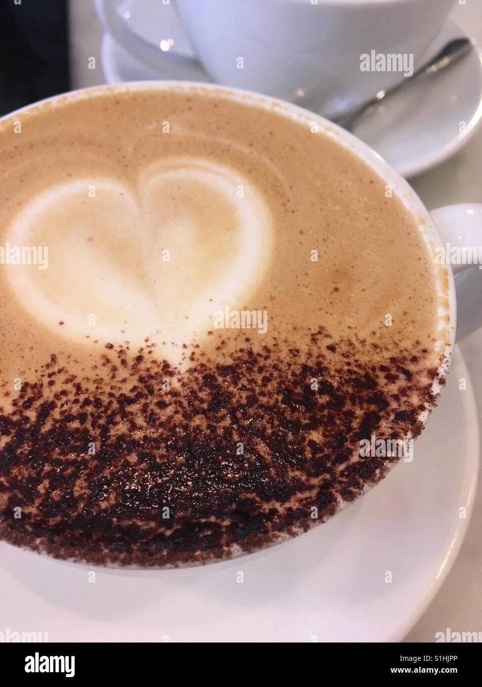 Latte art on a cappuccino Stock Photo