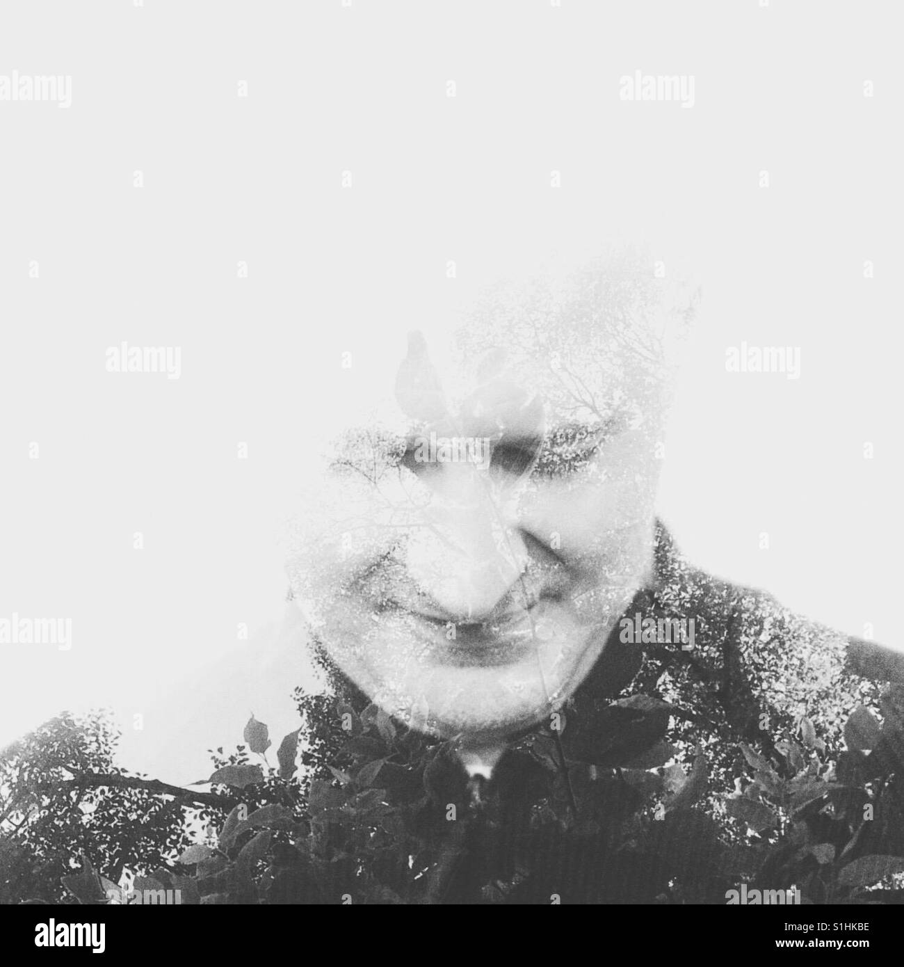 Adult man potrait with double exposure nature effect in monochrome - Smartphone Captured Stock Image