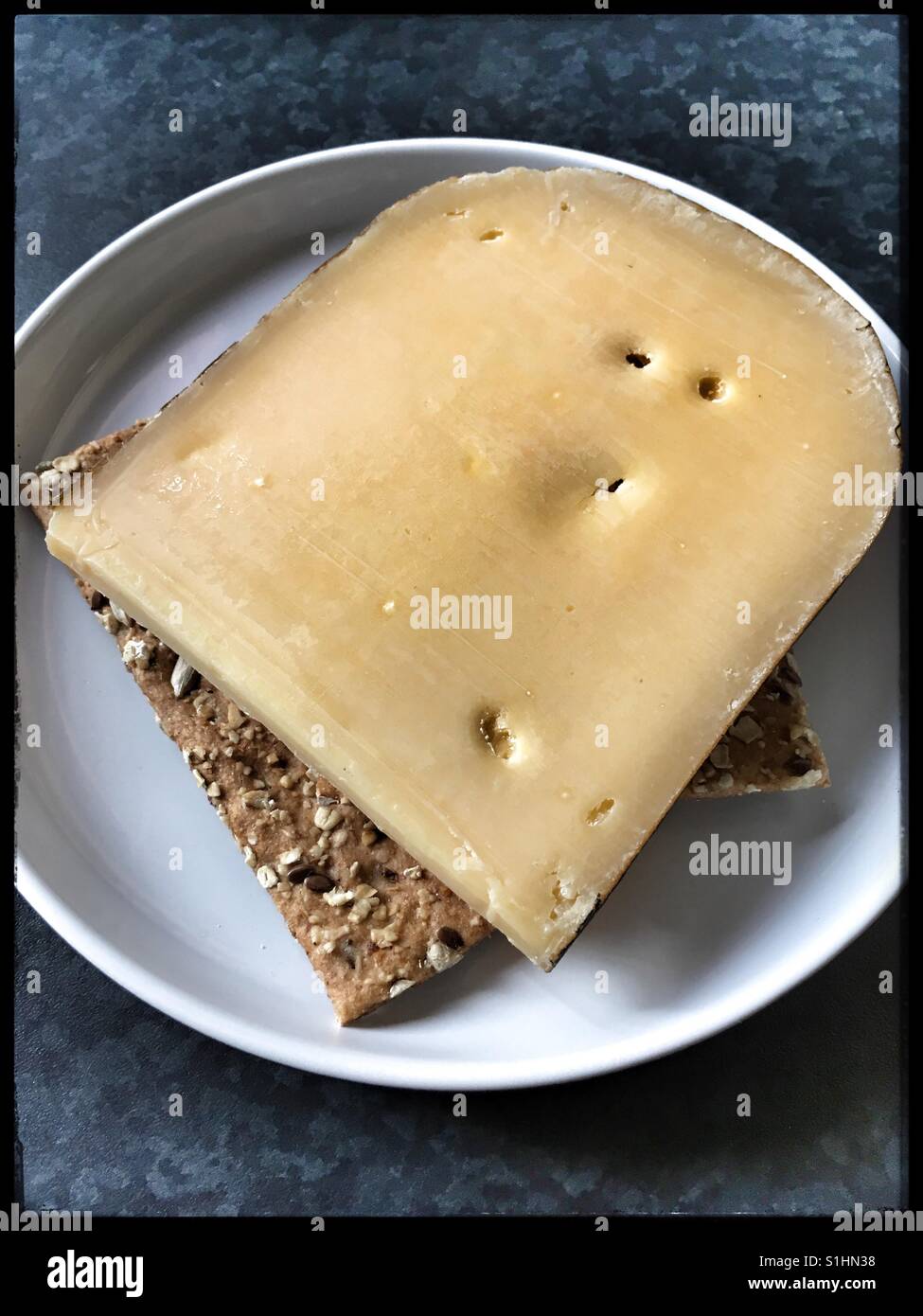 Extra Mature Dutch Gouda with Spelt Cracker Bread. Stock Photo