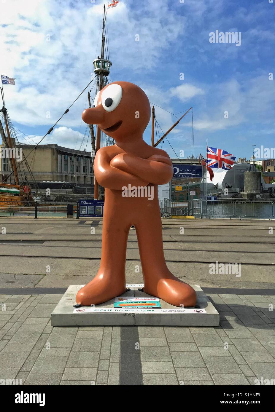 A statue of cartoon character Morph stands outside M Shed museum in Bristol, UK to mark his fortieth birthday. - Smartphone Captured Stock Image
