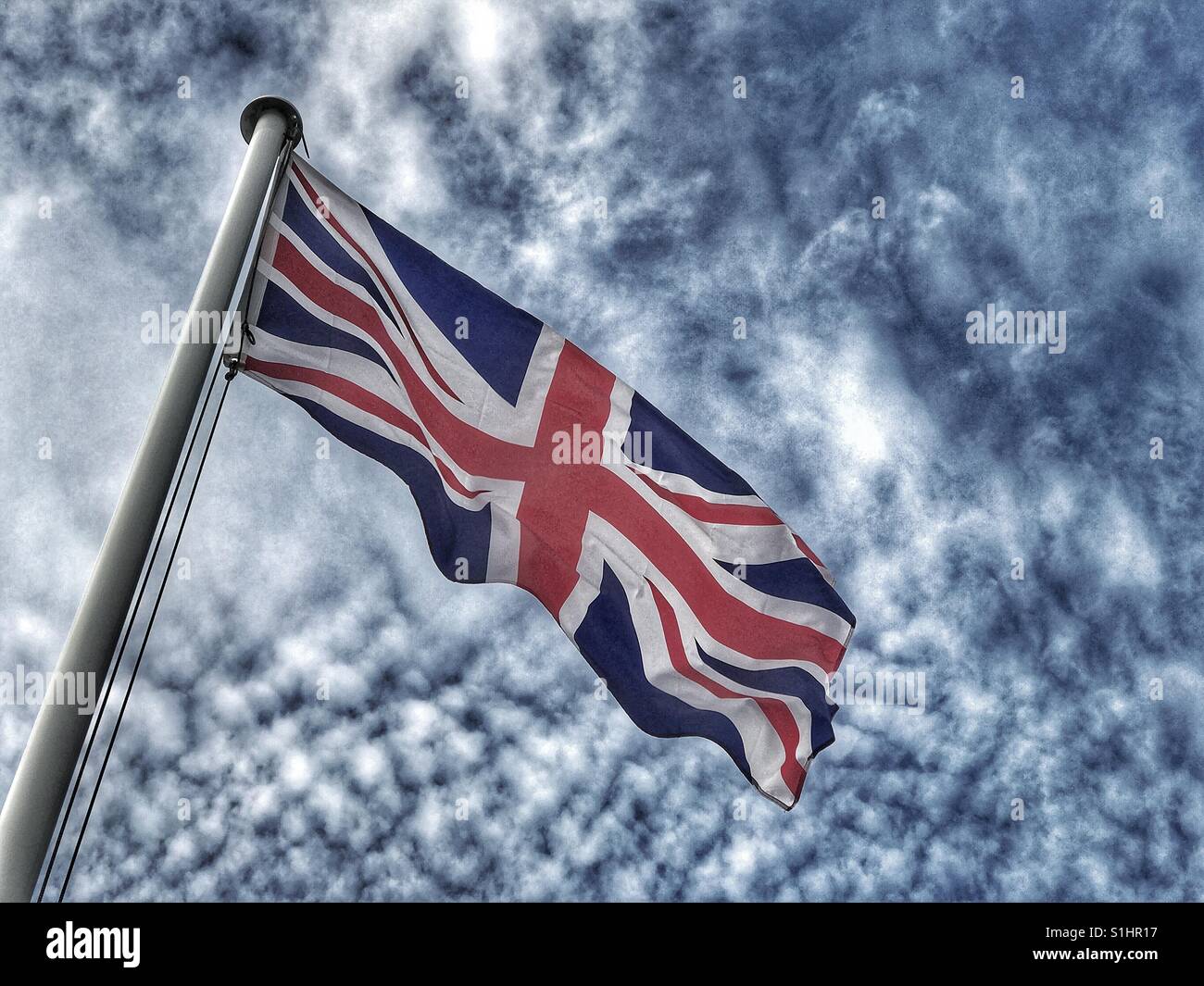 A washed out and "pasty" coloured Union Jack flag represents the United Kingdom of Great Britain & Northern Ireland. A picture with a political comment in the light of BREXIT! Photo © COLIN HOSKINS. - Smartphone Captured Stock Image