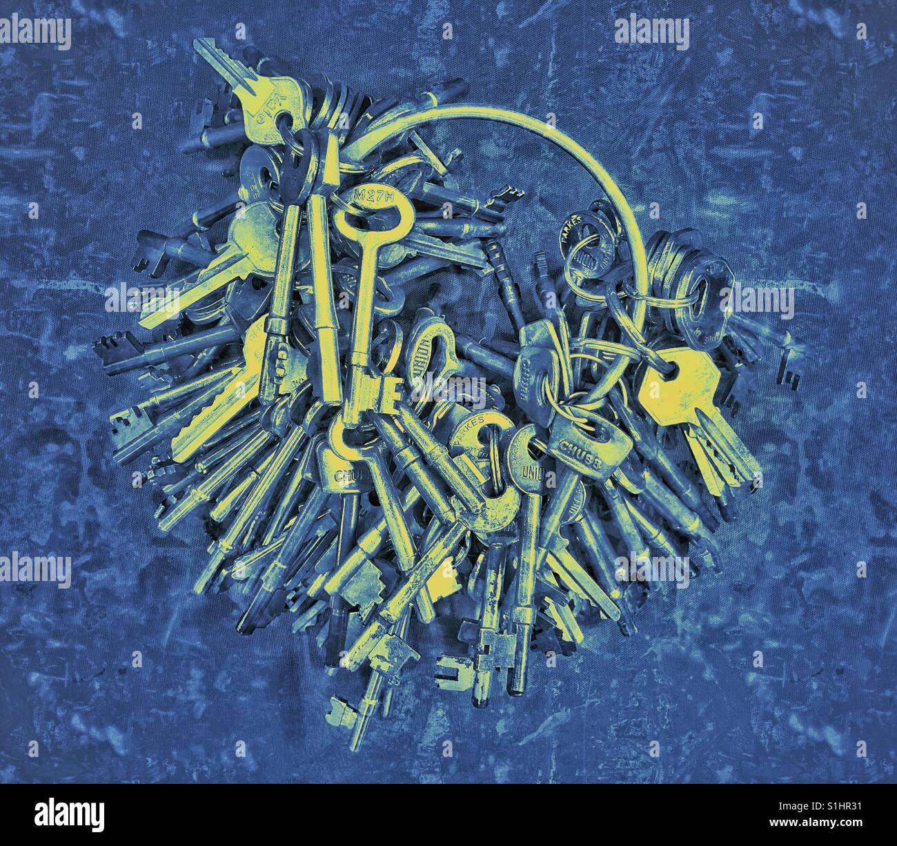 A large collection of different keys-all used in a prison in the United Kingdom in the 1980's. The grunge effect & psychedelic colours add to the tragedy of the human condition. Photo © COLIN HOSKINS. - Smartphone Captured Stock Image