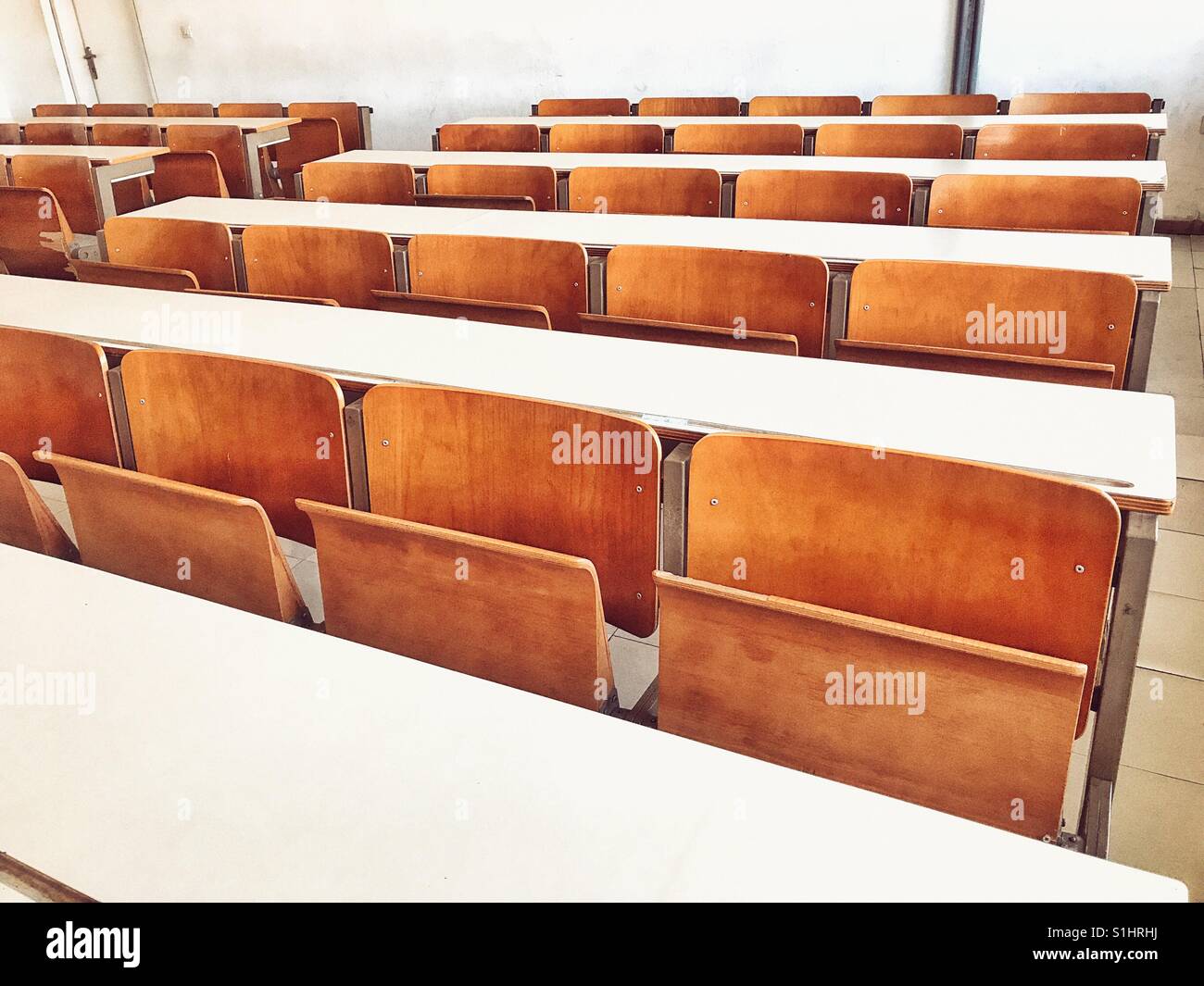 Closeup student chair seat and desk in classroom background with on wooden  floor. Education and Back to school concept. Architecture interior. Social  Stock Photo - Alamy