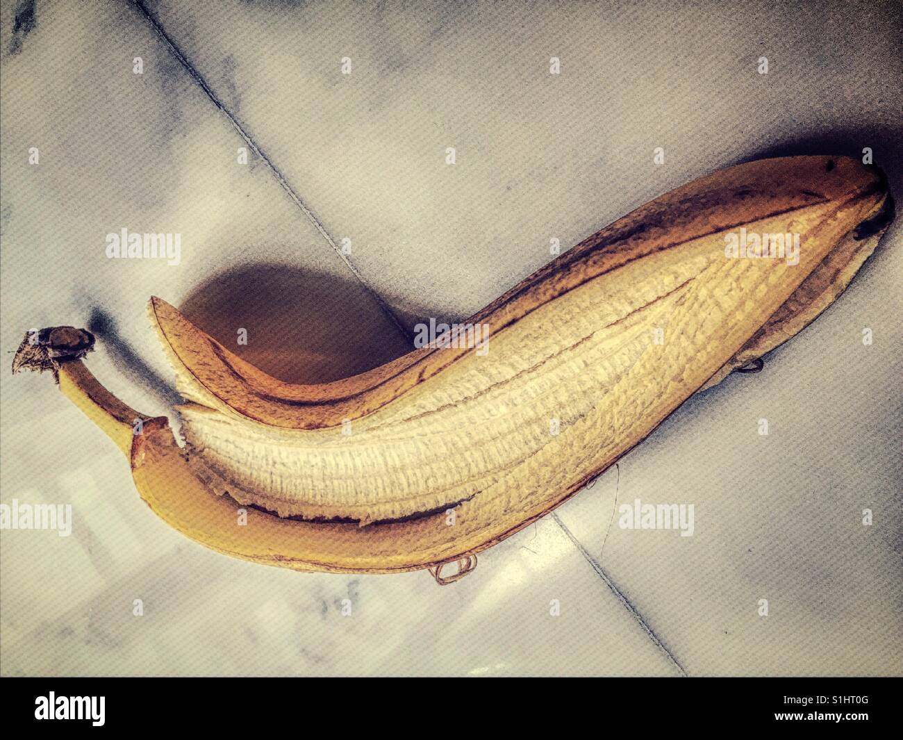 Close up of ripe banana peel with fruit removed. - Smartphone Captured Stock Image