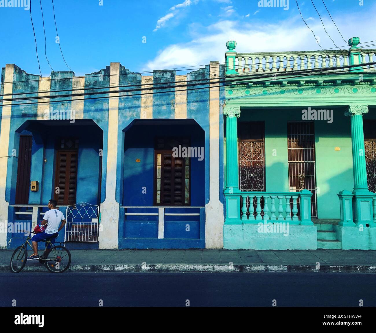 Young man on bike in street of Pinar Del Rio Cuba - Smartphone Captured Stock Image