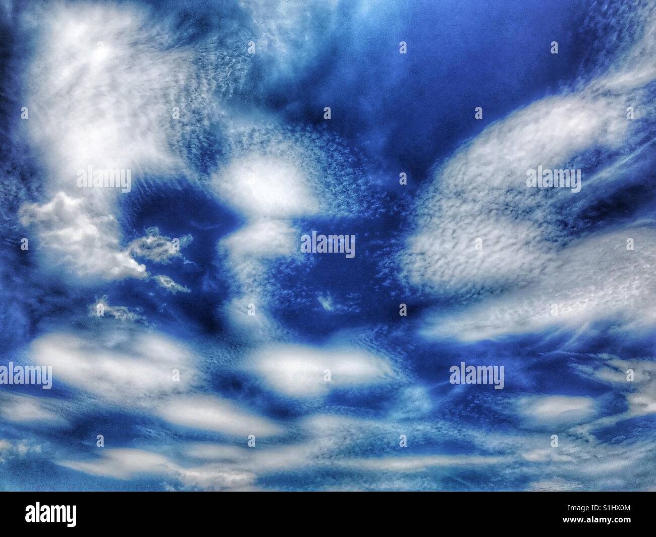 Surreal clouds against a cobalt sky - Smartphone Captured Stock Image