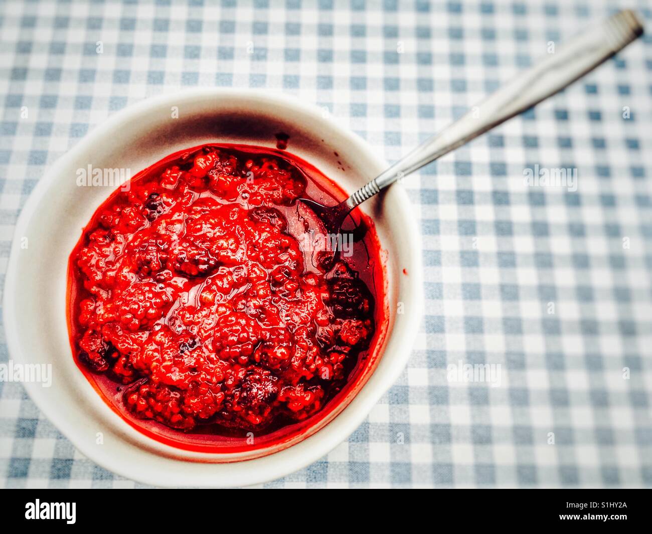 Cooked raspberries and black currents Stock Photo - Alamy