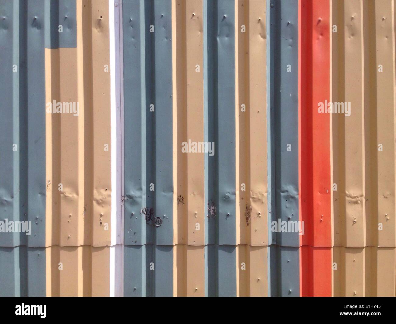 Sheet metal wall painted in different colors - Smartphone Captured Stock Image