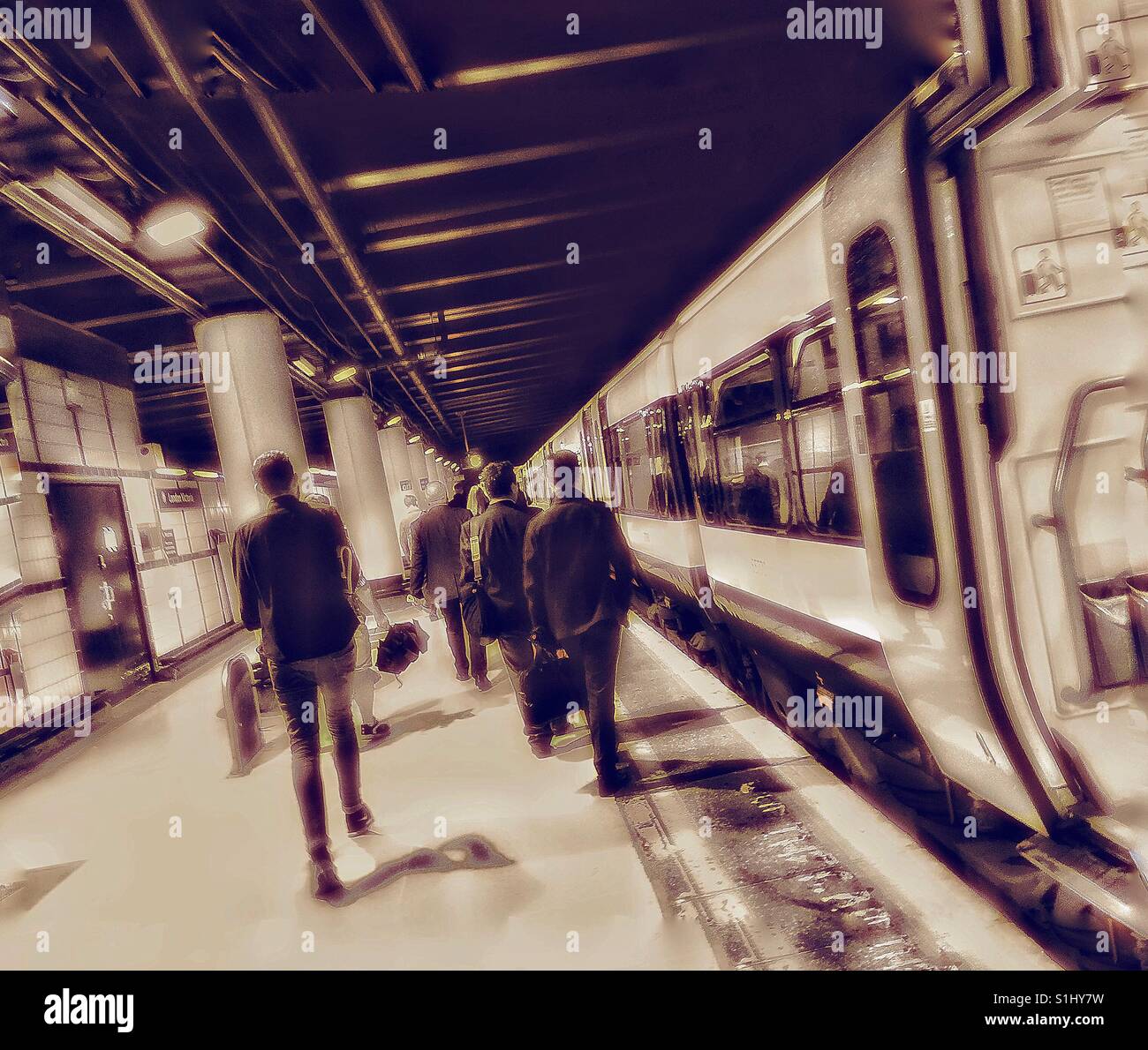 Commuters at London Victoria train station. - Smartphone Captured Stock Image