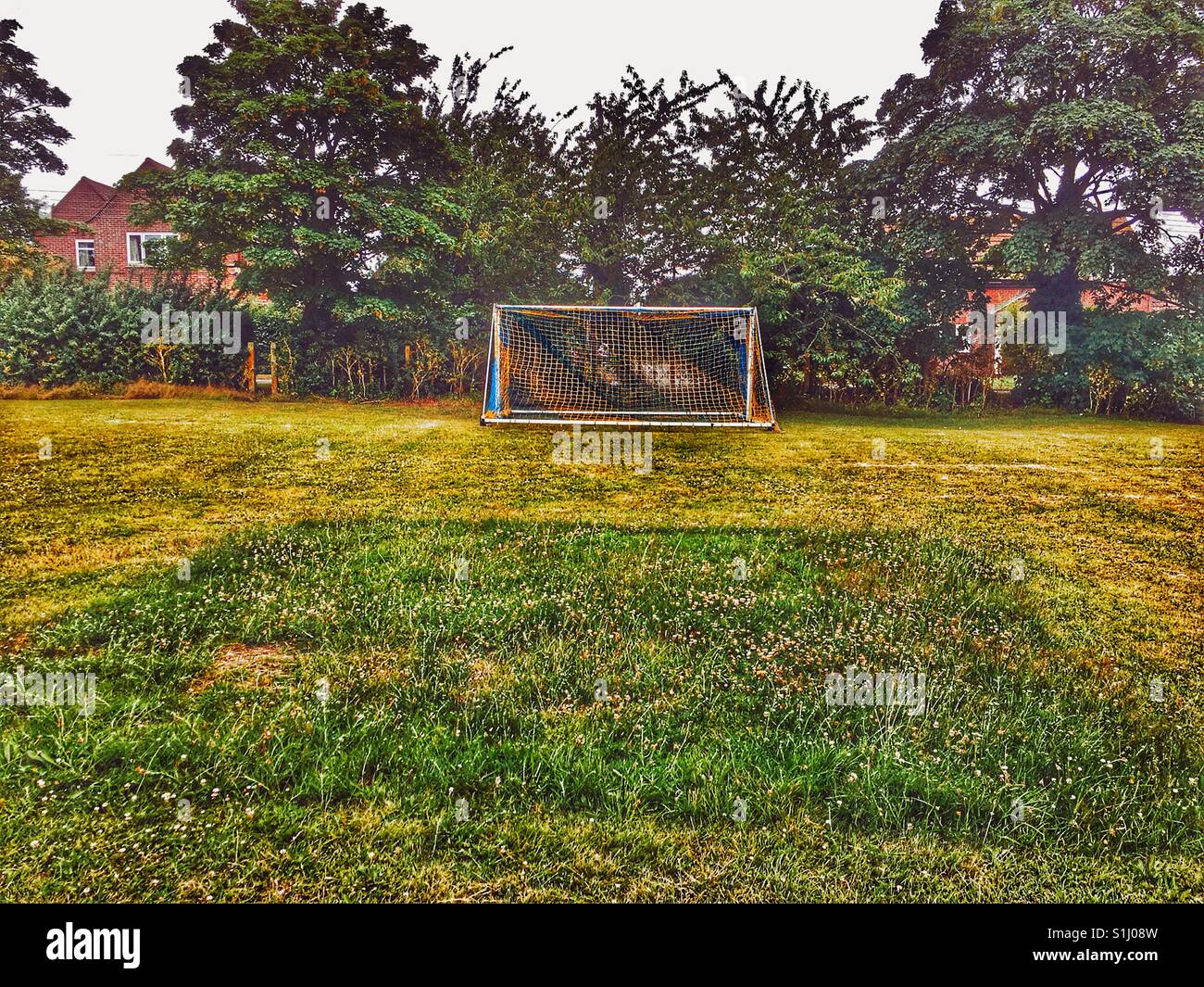 Mown football pitch with long grass left where the goalposts were in position, Alderton, Suffolk, England. - Smartphone Captured Stock Image