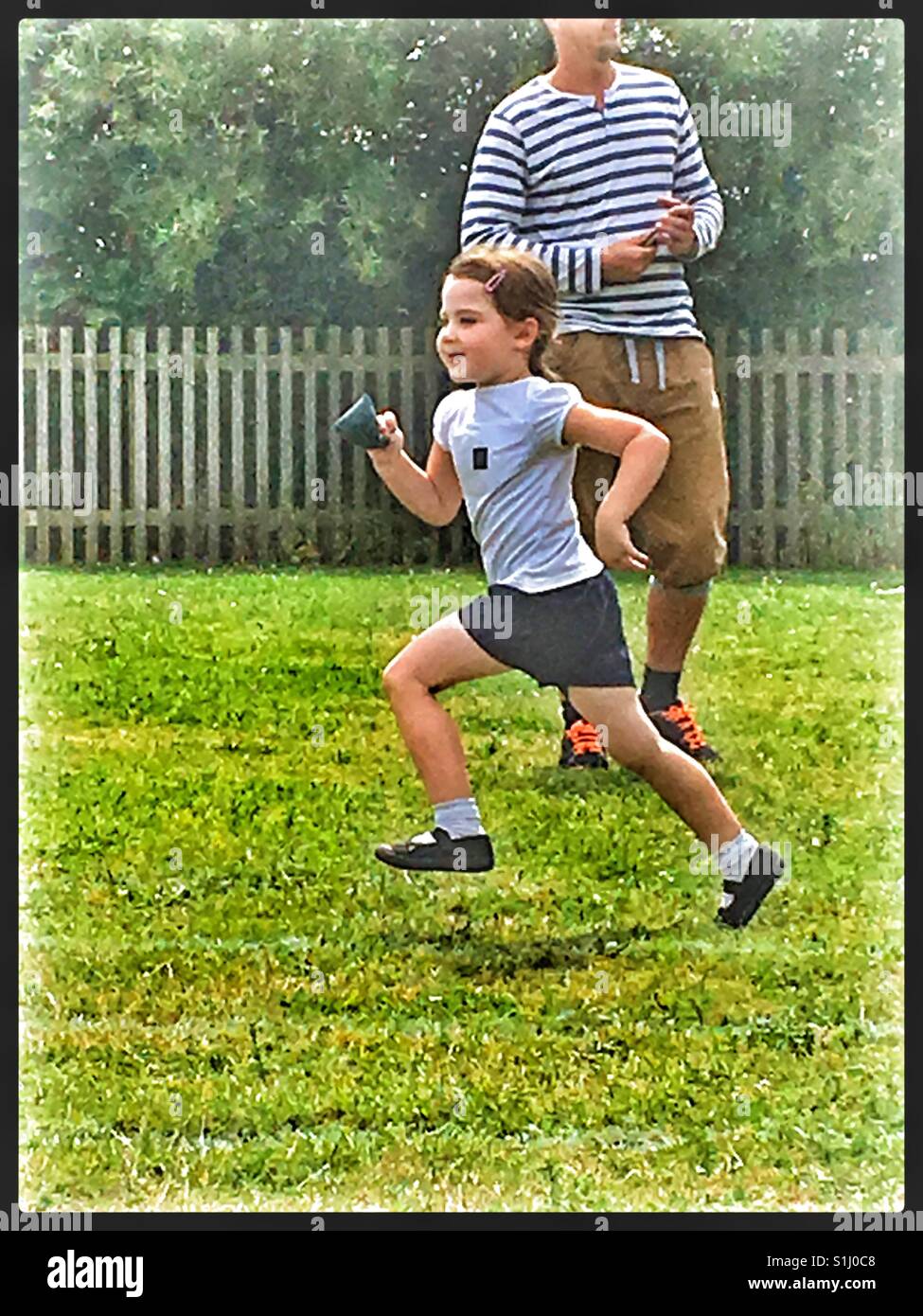 Girl in Bean Bag race at Primary School Sports Day Stock Photo Alamy