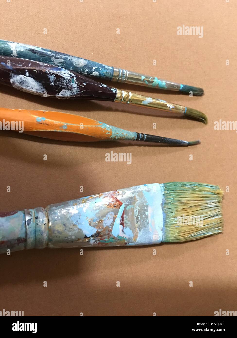 Paint brushes close up on dry paint Stock Photo Alamy