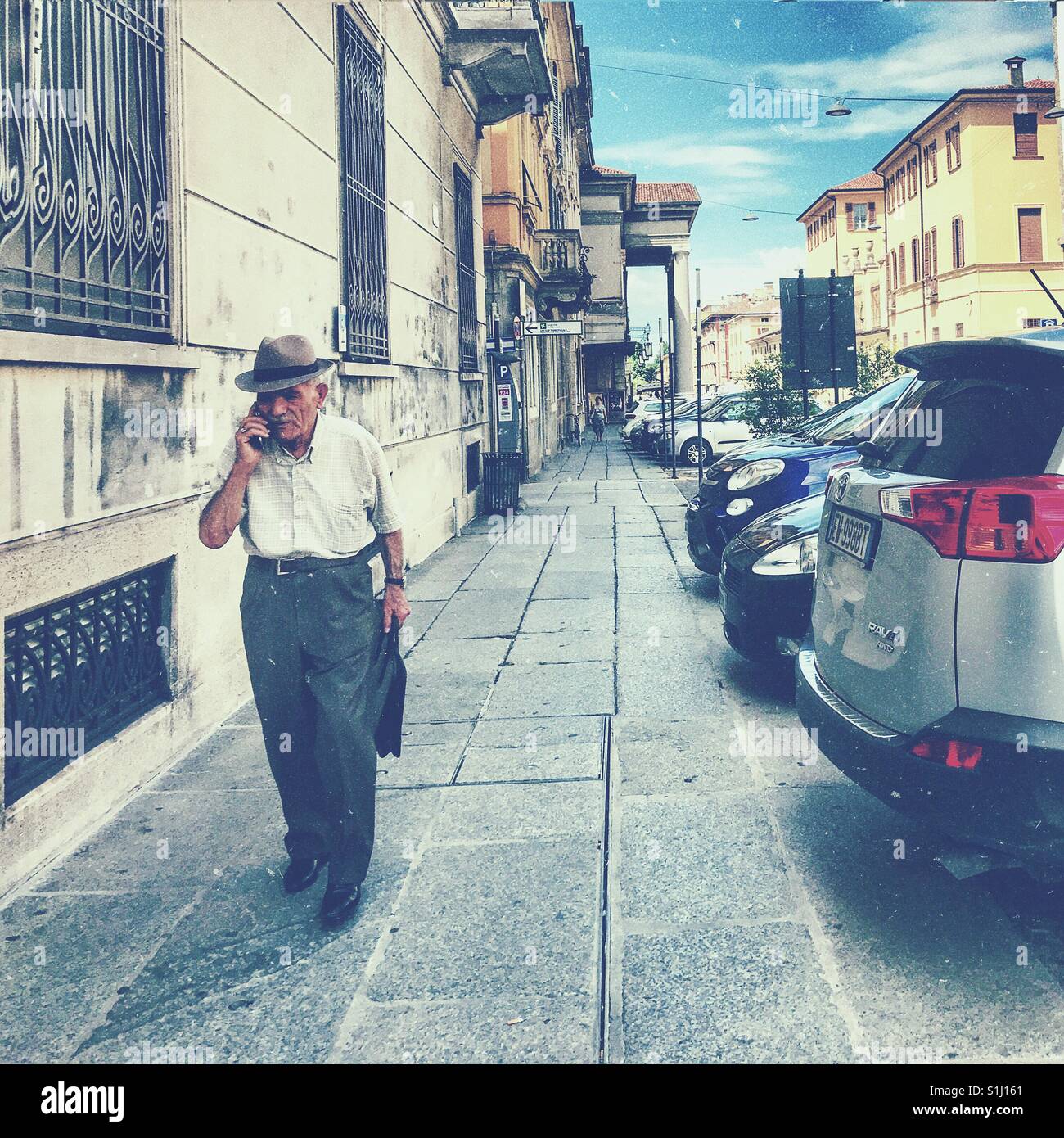 Old man walking phone hi-res stock photography and images - Alamy