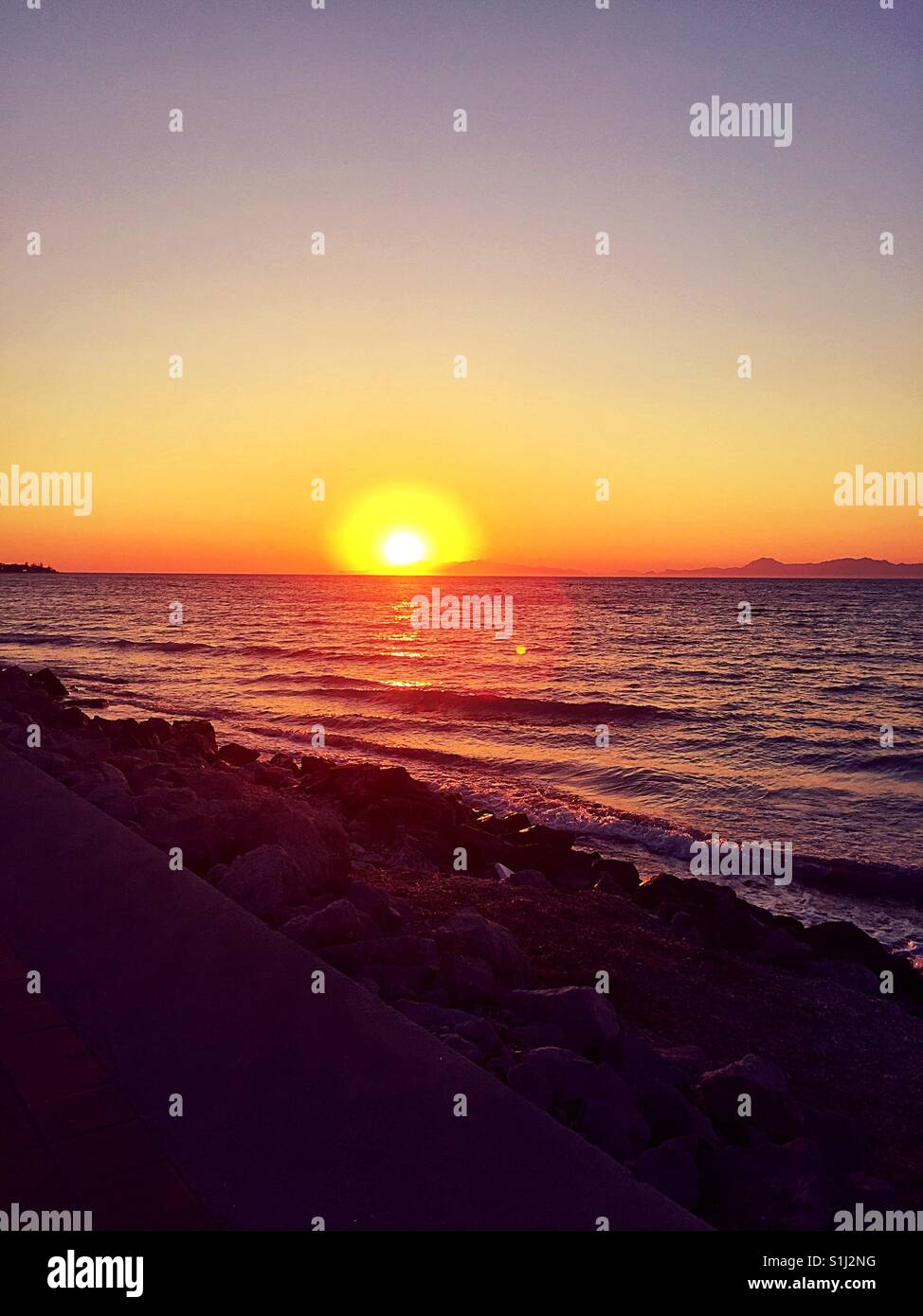 Sun set over Greece facing towards Turkey - Smartphone Captured Stock Image