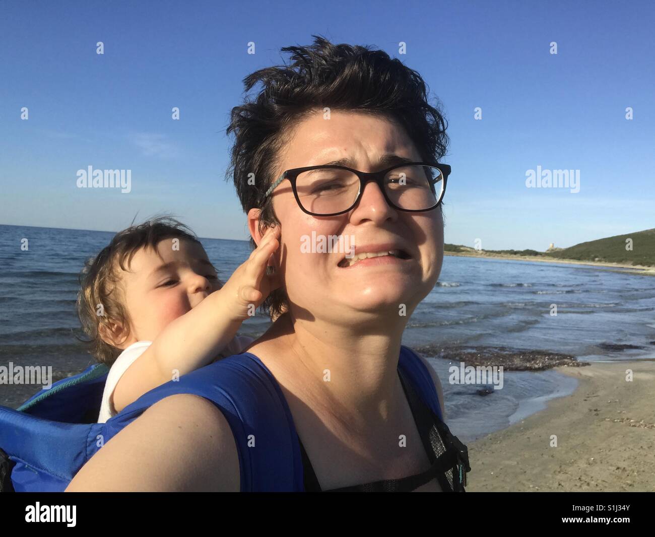 Selfie portrait of mother and baby on the beach Stock Photo