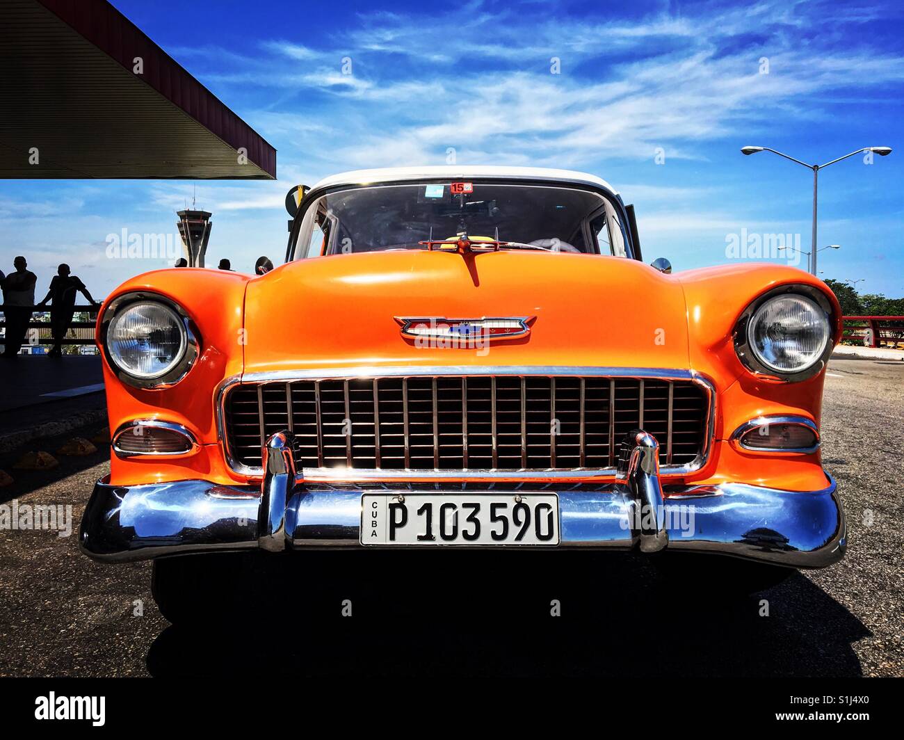 Orange 1950's Chevrolet at Havana Airport Cuba Stock Photo