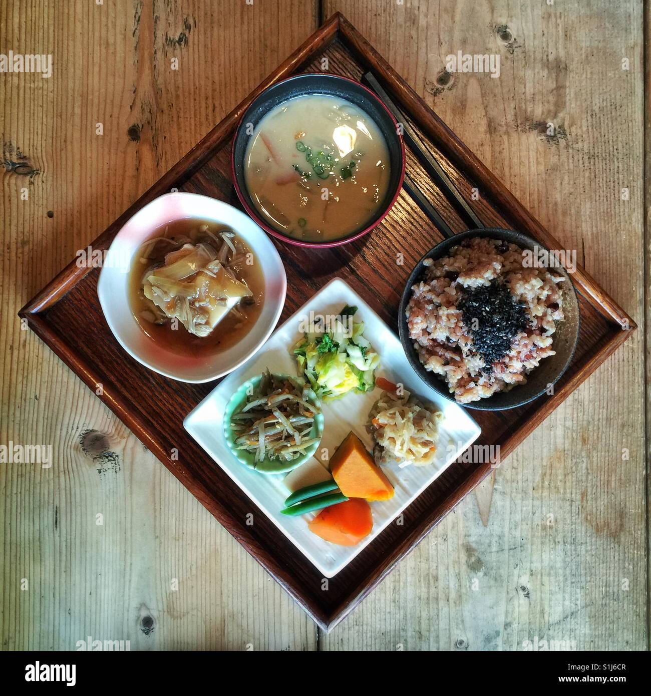 Traditional Japanese vegan meal on a wooden tray Stock Photo
