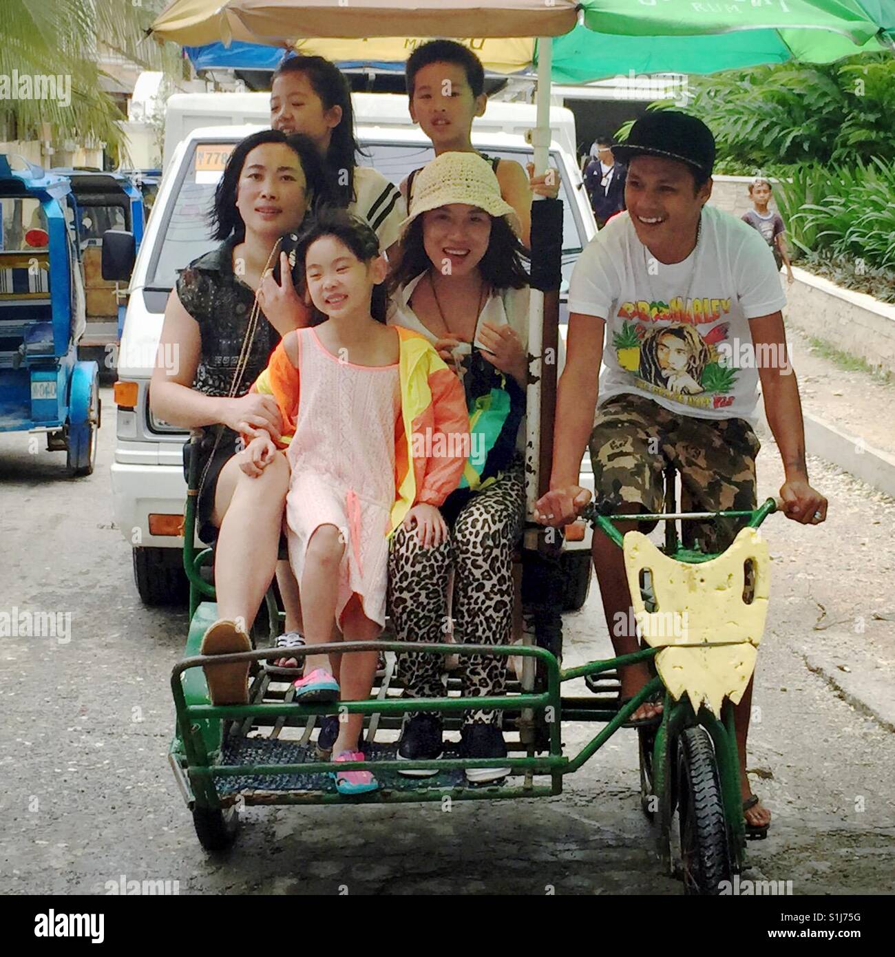 Group of happy people riding on a trike in Philippines Stock Photo Alamy