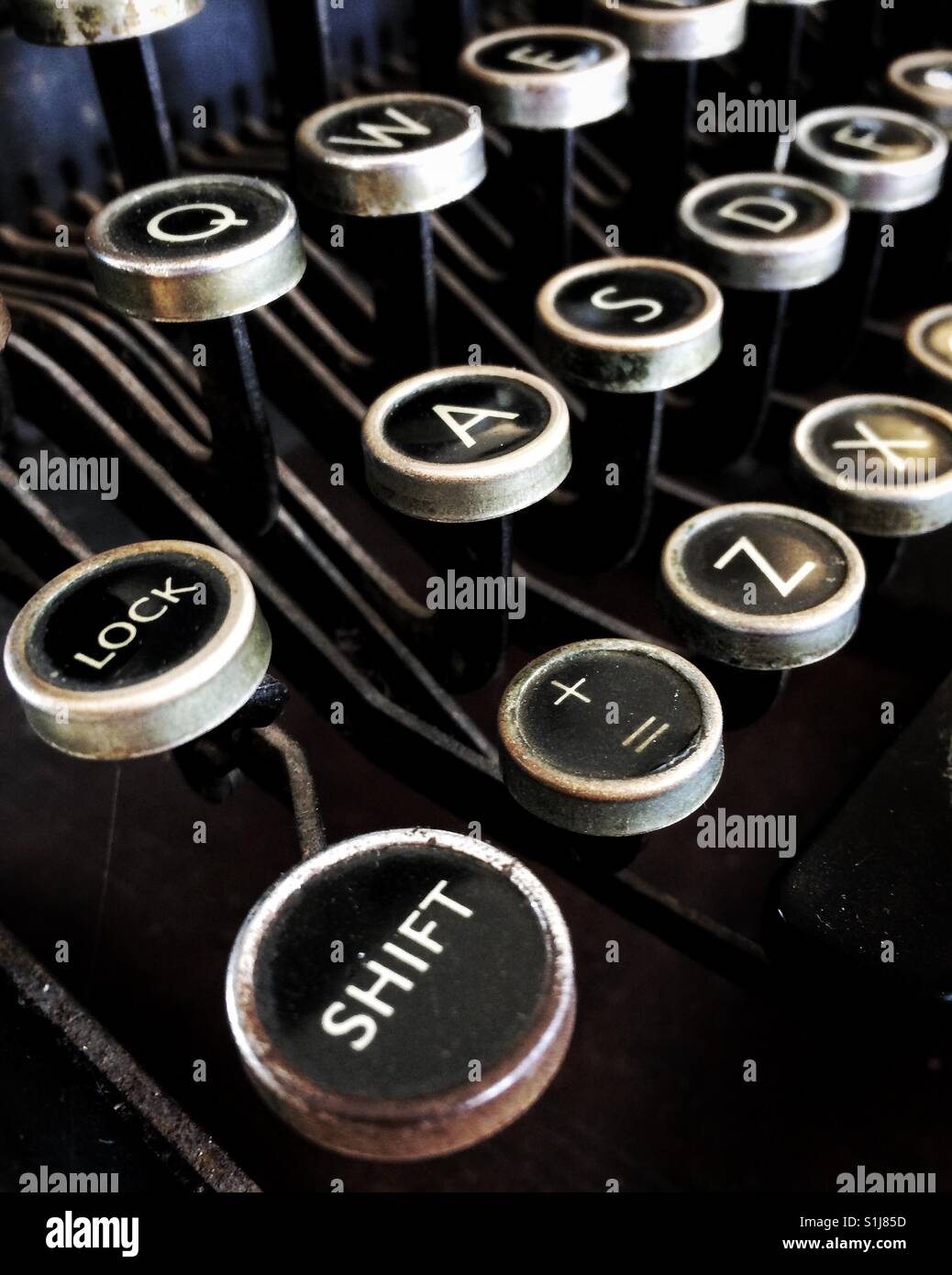 The shift key and other keys on the qwerty keyboard of an oldfashioned