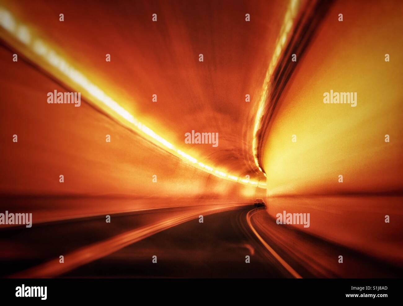 Fast moving drive through a mountain tunnel. Trans Canada Highway 1, Fraser Canyon section, British Columbia, Canada. - Smartphone Captured Stock Image