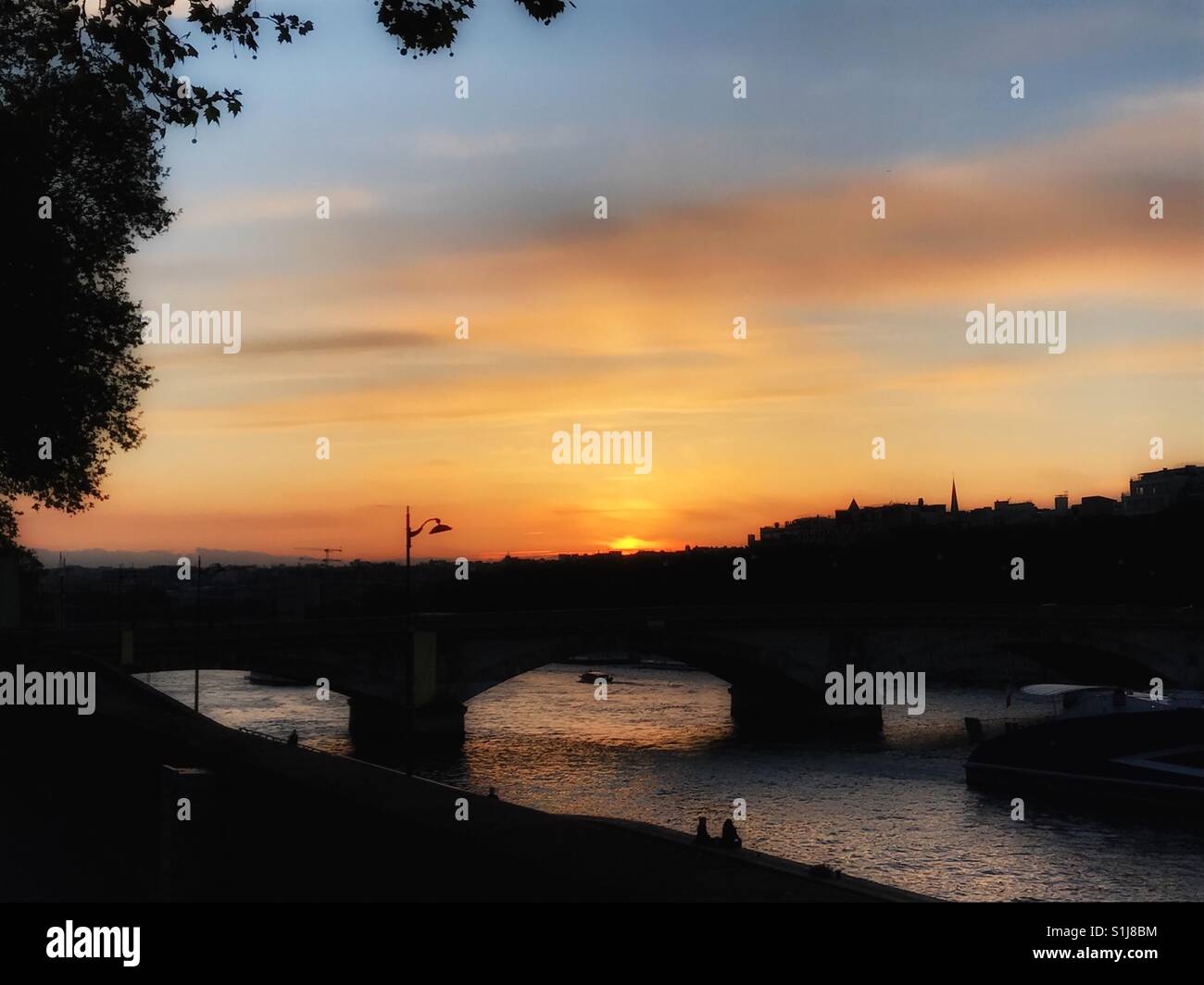 Sunset behind Invalides Bridge - Smartphone Captured Stock Image