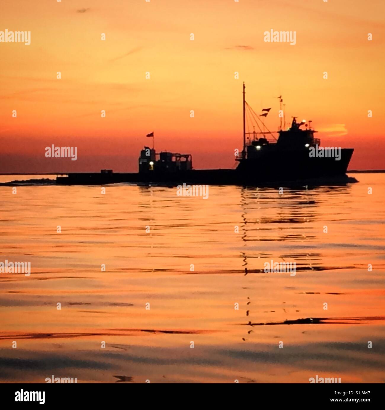Fishing boat at sunrise on the Chesapeake Bay. Stock Photo