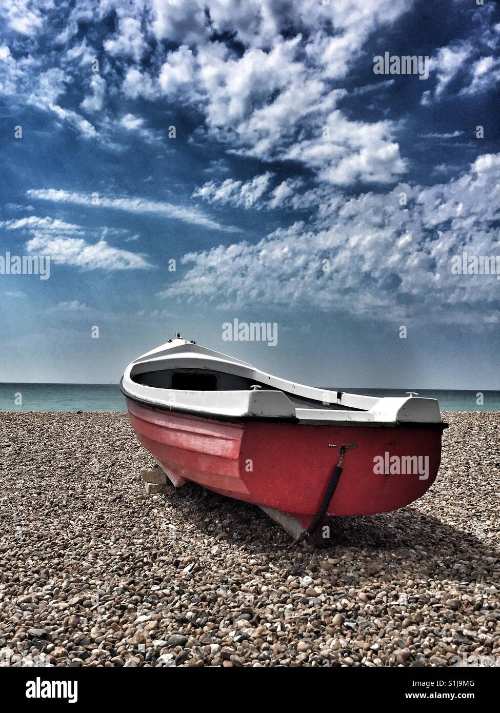 Empty fishing boat on Rustington Beach, West Sussex - Smartphone Captured Stock Image