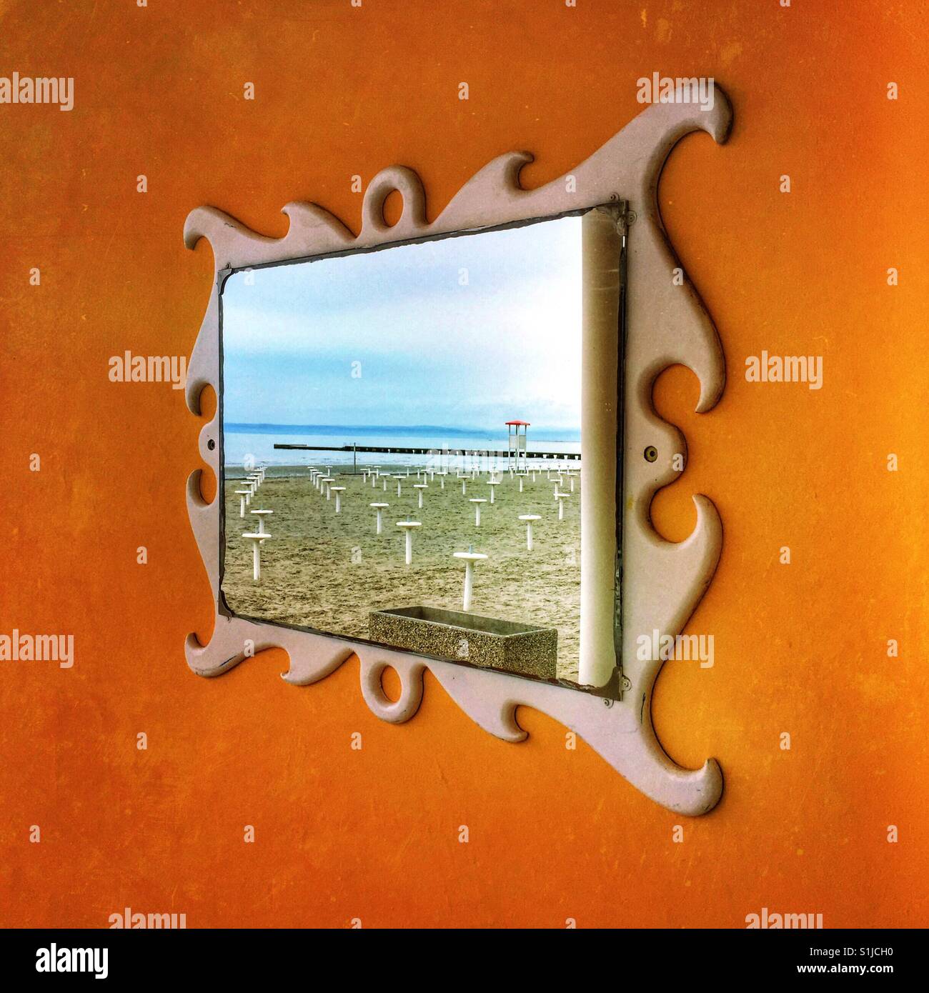 Empty beach reflected in a mirror - Grado, Italy - Smartphone Captured Stock Image