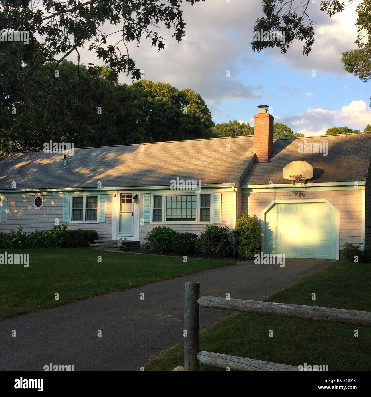Late afternoon summertime view of a home in Dennis, Cape Cod, Massachusetts, United States - Smartphone Captured Stock Image