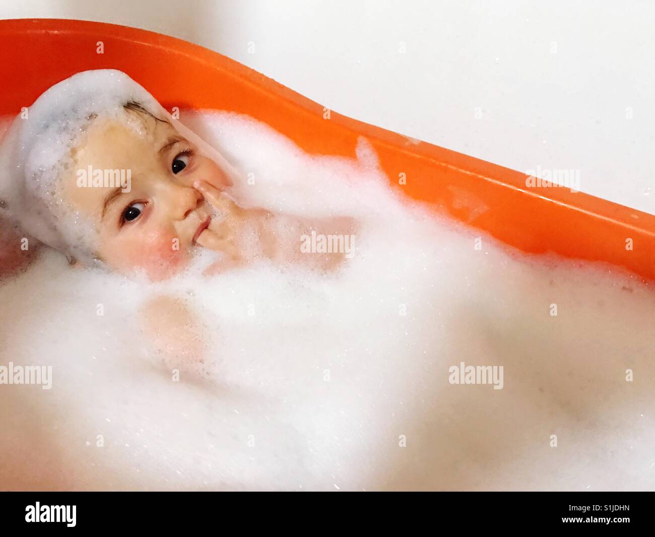Baby taking a bath Stock Photo Alamy
