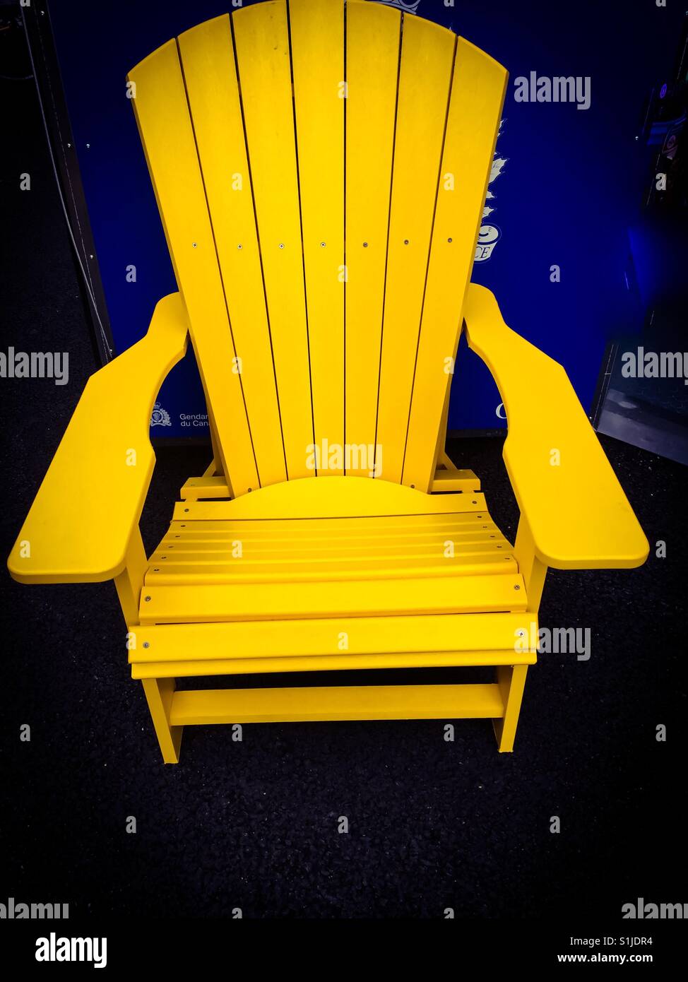 Yellow Adirondack chair - Smartphone Captured Stock Image