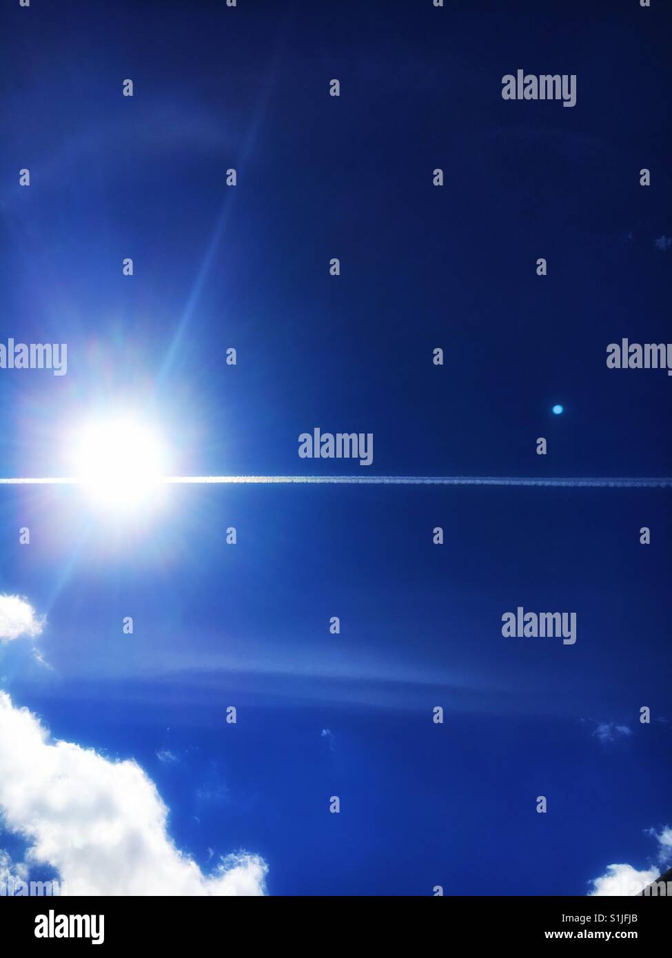 Bright sun, blue sky - Smartphone Captured Stock Image