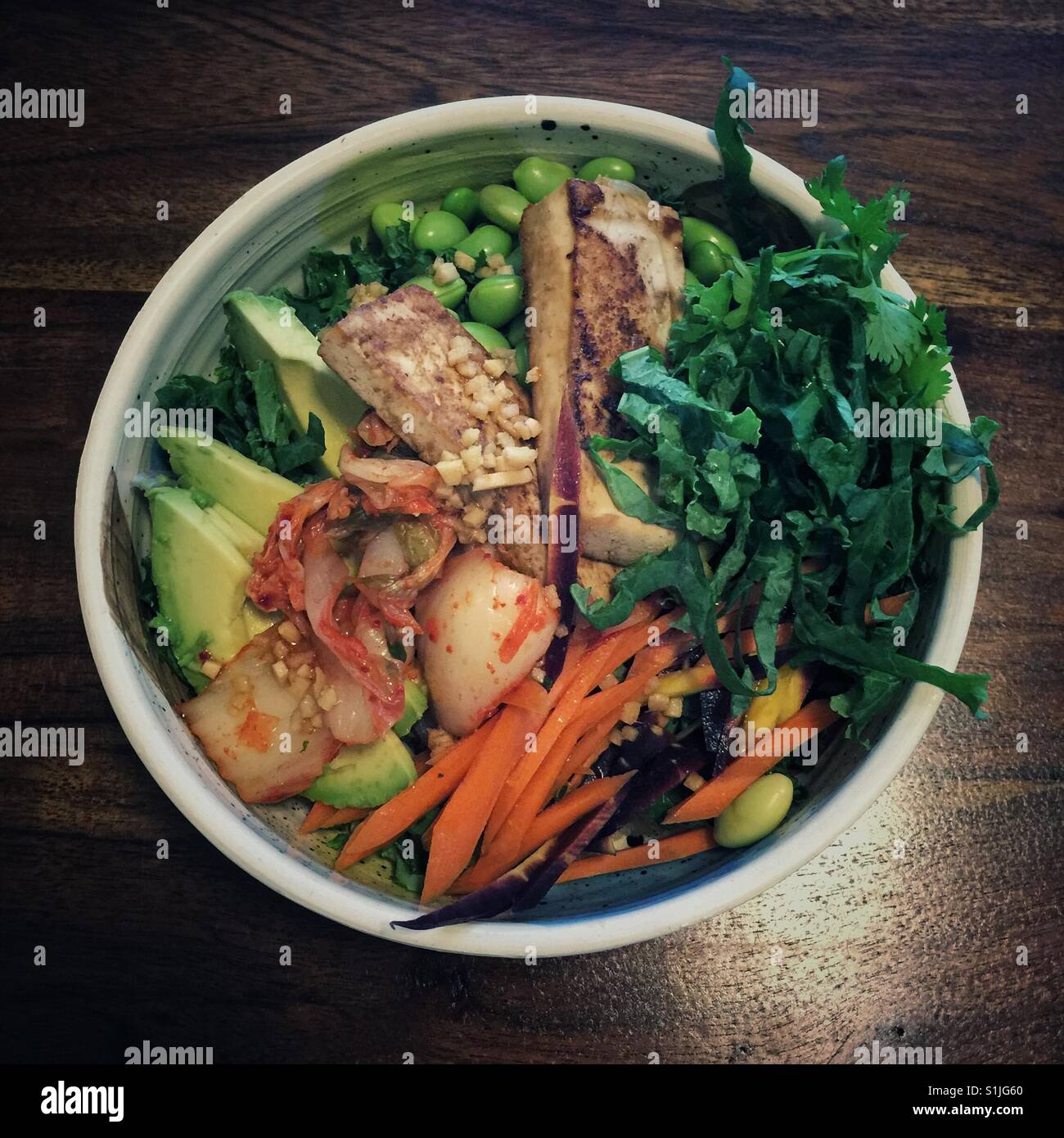 Fancy vegan grain and vegetables bowl with kimchi Stock Photo