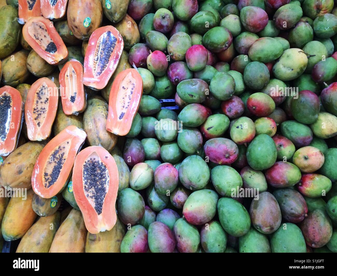 Fresh papayas and mangos at the Mercado, puerto Vallarta, Mexico Stock Photo