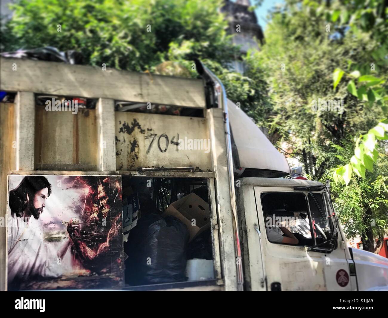 An image of Jesus arm wresting decorates a truck in Mexico City, Mexico Stock Photo