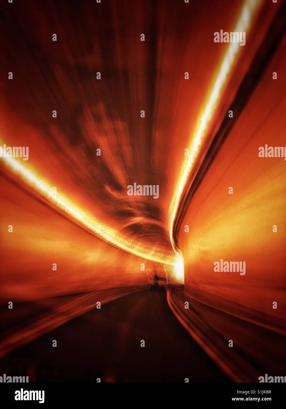 Fast moving drive through a mountain tunnel. Trans Canada Highway 1, Fraser Canyon section, British Columbia, Canada. - Smartphone Captured Stock Image