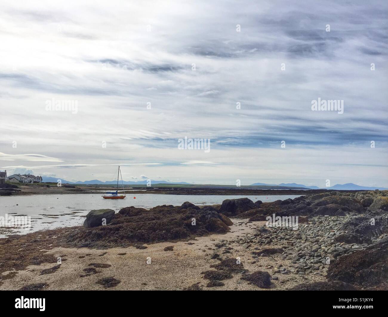 Boat on mooring on Rhosneigr Beach, Anglesey, North Wales, Ynys Mon - Smartphone Captured Stock Image