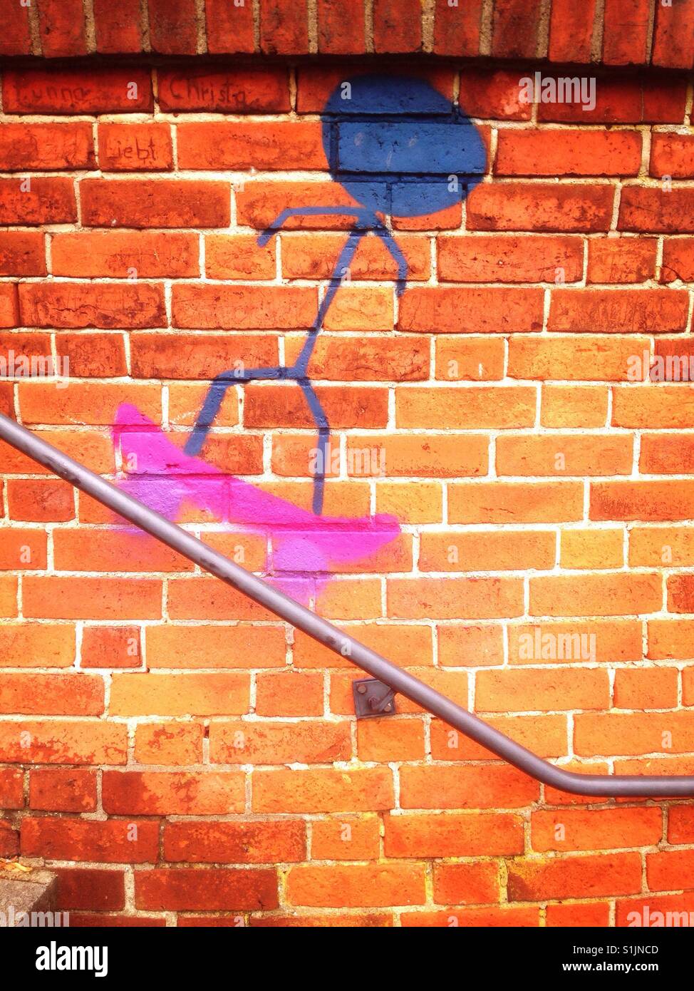 Skater painted on a brick wall - Smartphone Captured Stock Image