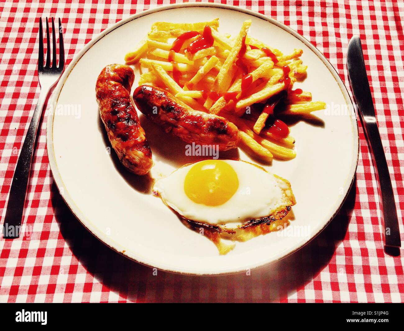 Sausage egg and chips from a cafe Stock Photo Alamy