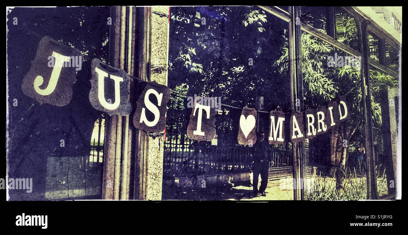Just Married sign hanging on a bus window. - Smartphone Captured Stock Image