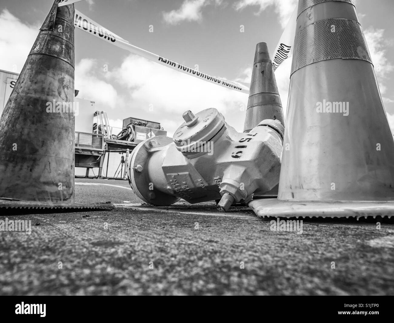 Fire hydrant knocked over on sidewalk - Smartphone Captured Stock Image